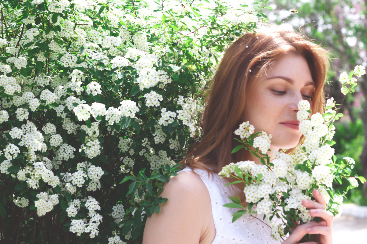 Beautiful red haired woman among white spring flow 2022 11 16 11 20 53 utc