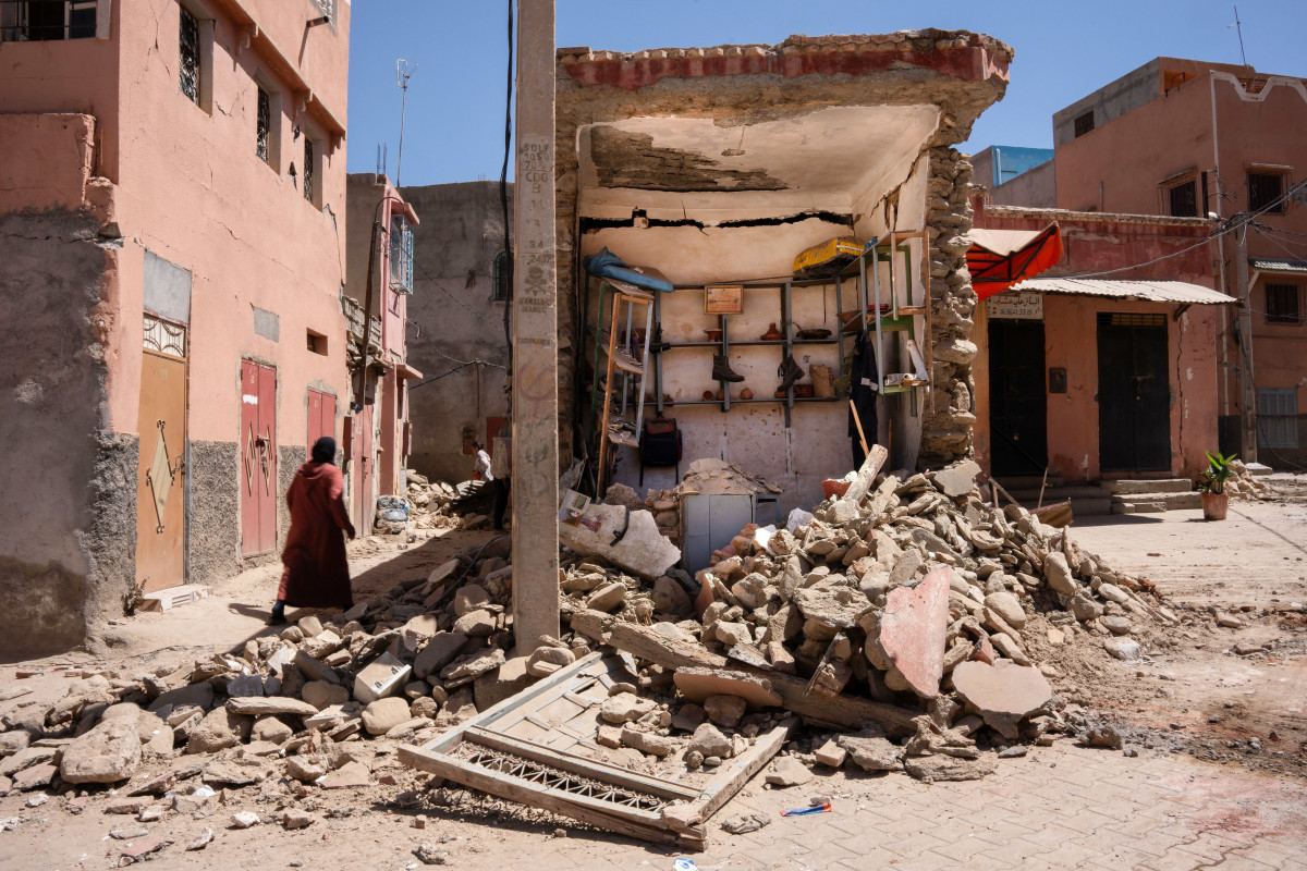 EuropaPress 5431063 september 10 2023 amizmiz morocco woman walks next to shop destroyed by the